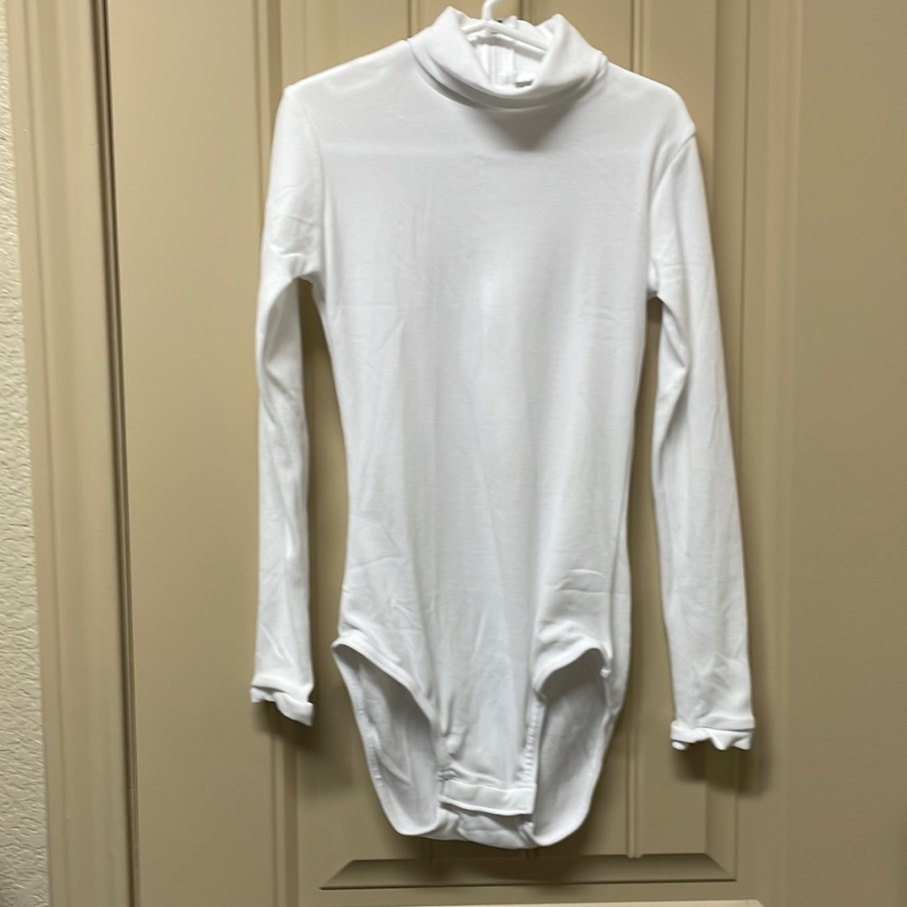 New W/O tags. Great for Cheer Season! Girl’s Medium long-sleeved white bodysuit